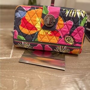 Turn Lock & Zip Organizer Wallet in the "Jazzy Blooms" pattern.